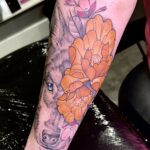 Floral wolf colour forearm tattoo